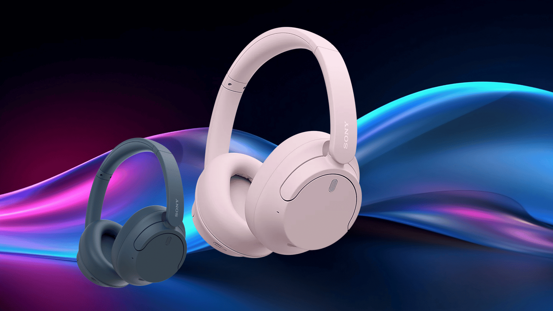 two Sony WH-CH720N wireless headphones in pink and dark blue displayed against a colorful flowing light background.