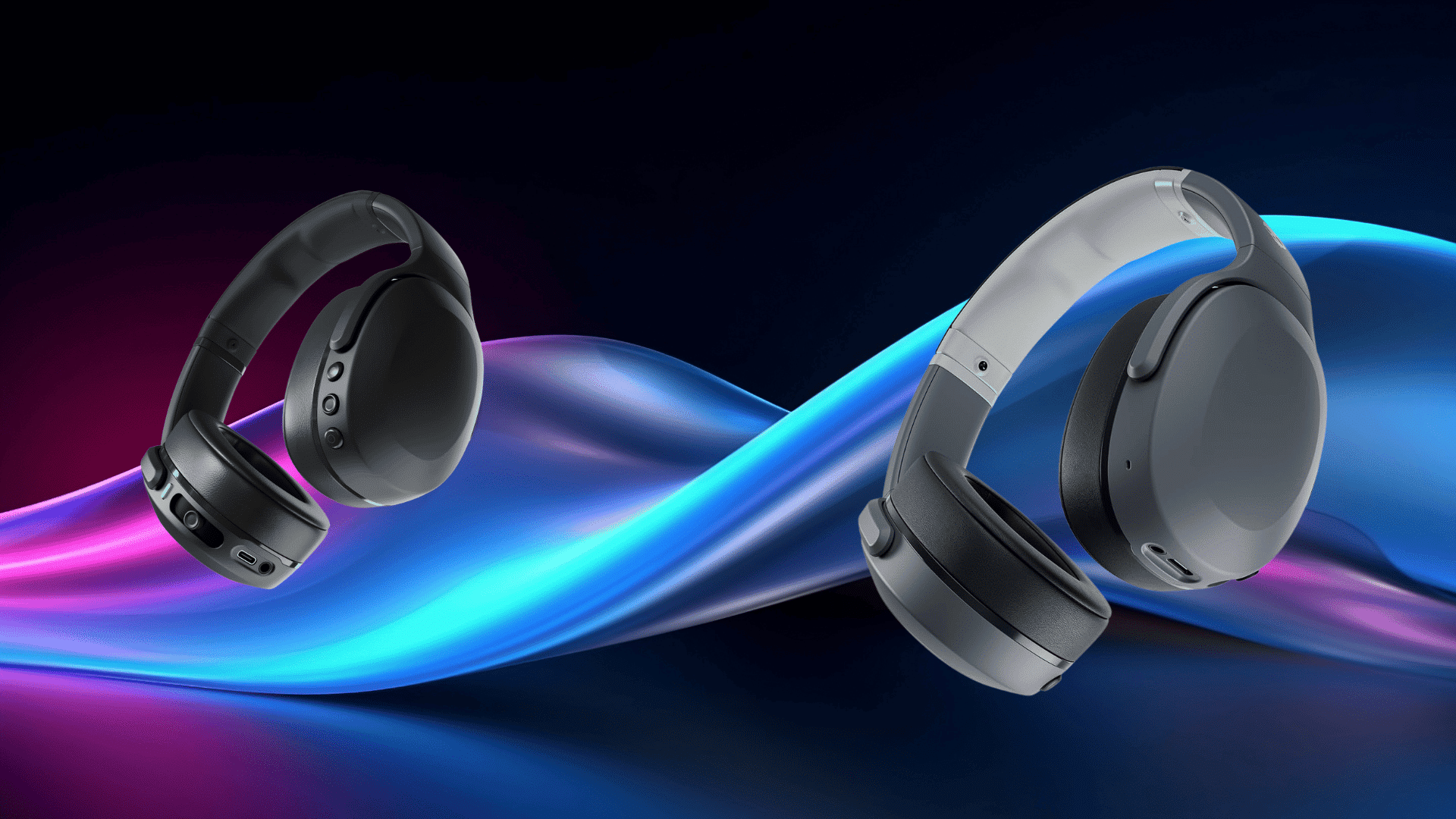 two over-ear wireless headphones in black and gray floating against a vibrant abstract wave background in blue, purple, and pink tones.