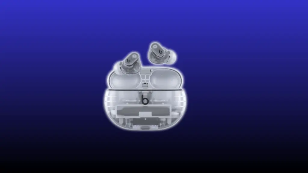 Beats Studio Buds Plus transparent case with earbuds on a blue background.