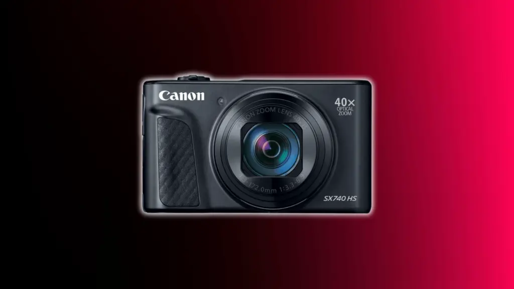 Canon PowerShot SX740 HS compact camera with long zoom lens shown against a black and red gradient background