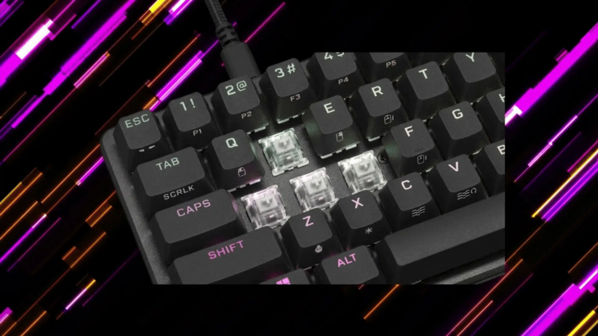 close-up of a mechanical keyboard with removed keycaps showing switches, set against a vibrant neon pink and purple abstract background.