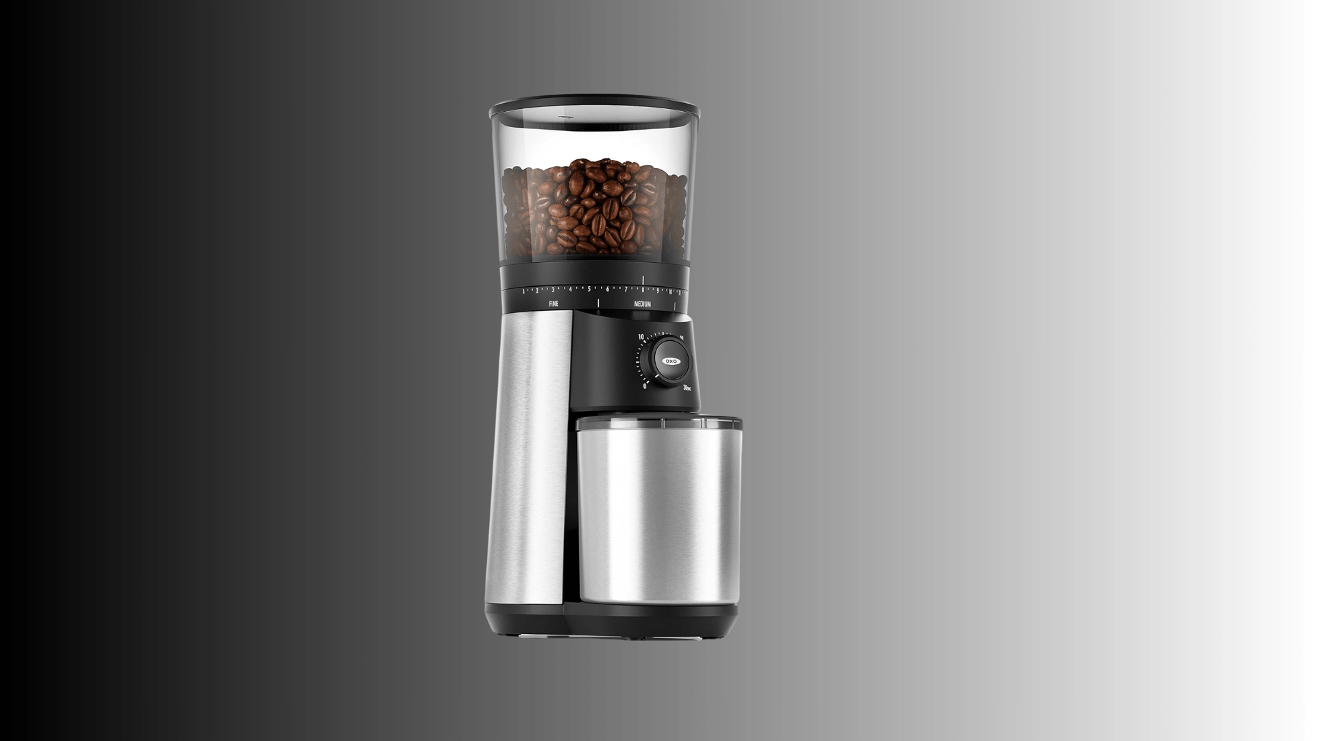 Electric coffee grinder with bean-filled hopper, metal body, and front control knob.