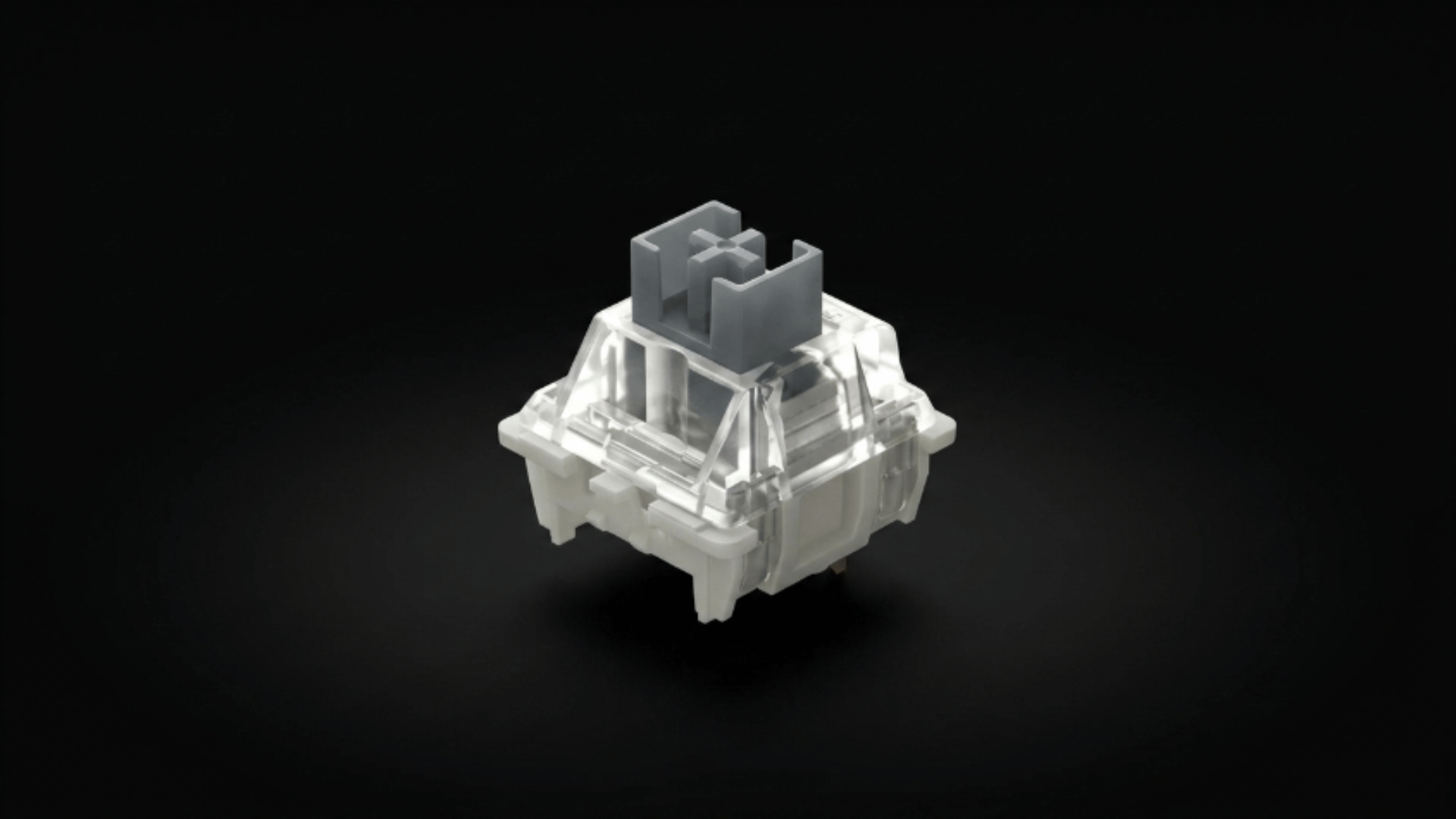 g pro 3.0 silvery switch close view with clear housing and silver stem placed on minimal clean surface