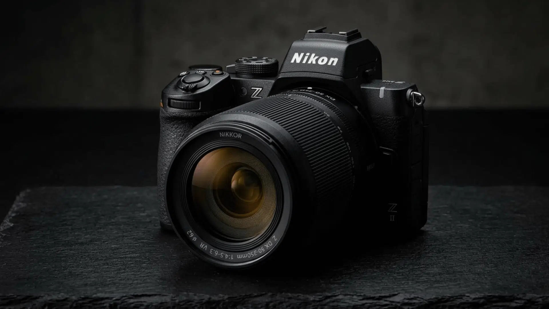 nikon z50 camera on black background with dramatic lighting and sharp focus
