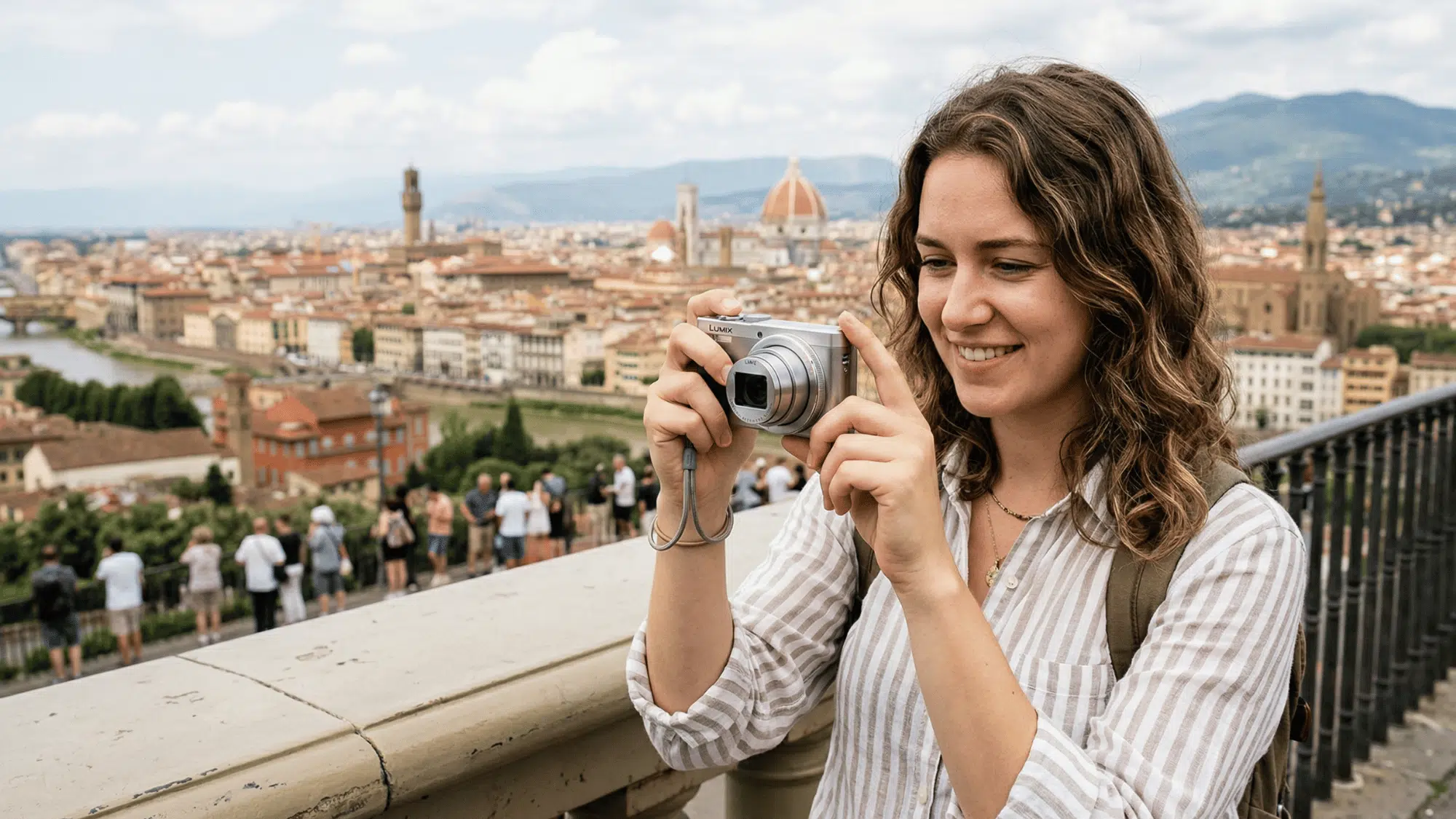 small point-and-shoot camera on a travel backpack with sunglasses and map, outdoor setting, natural sunlight, warm tones, lifestyle photography