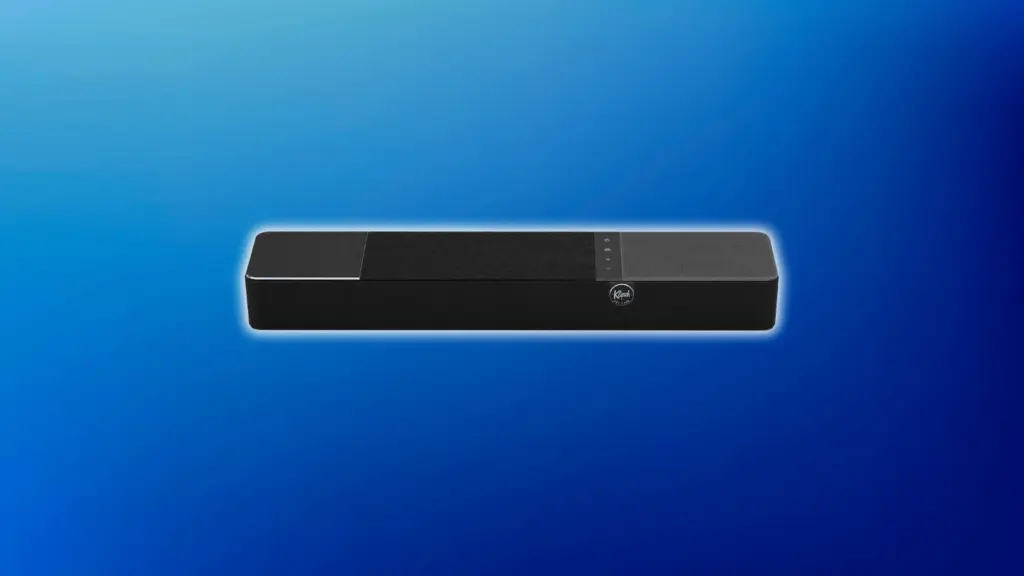 Black Klipsch soundbar with a segmented top panel, touch controls, and front logo, shown straight on against a light blue background.