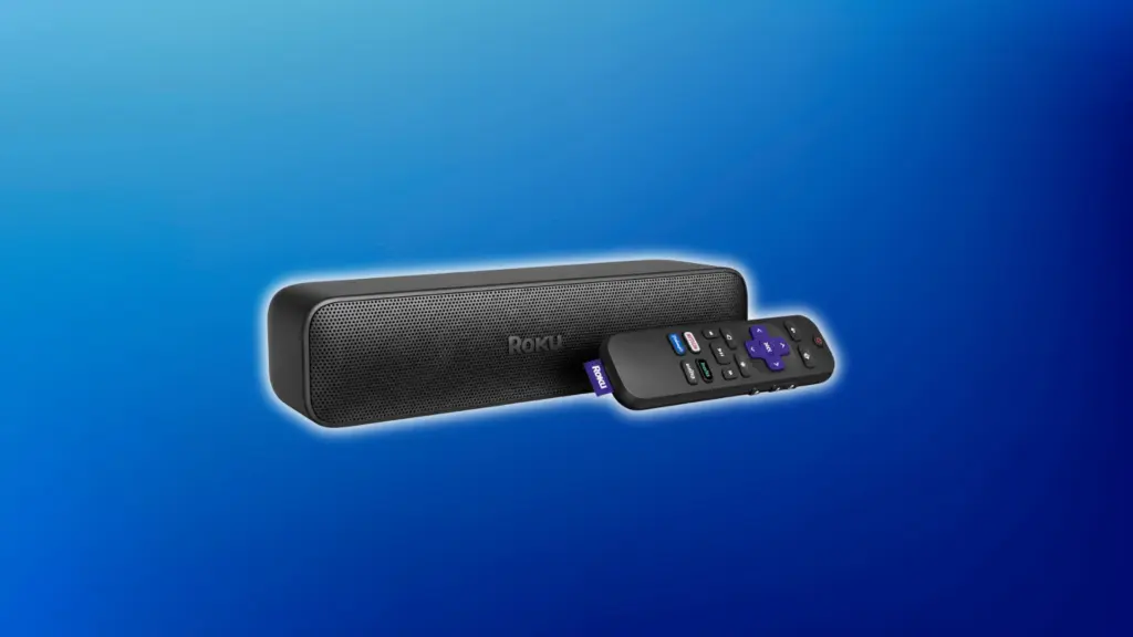 Black Roku soundbar with a perforated front grille and matching remote, displayed on a soft light blue gradient background.