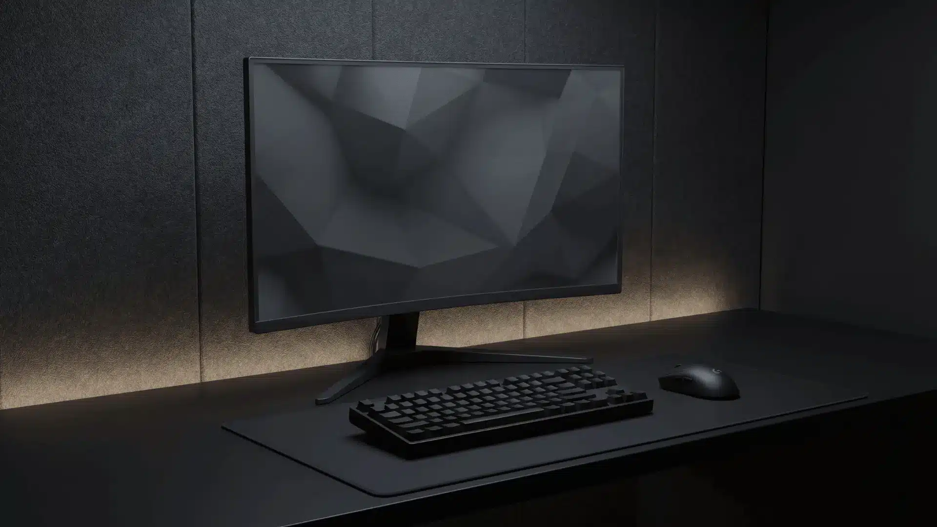 All-black desk setup with monitor and peripherals in a clean minimal arrangement