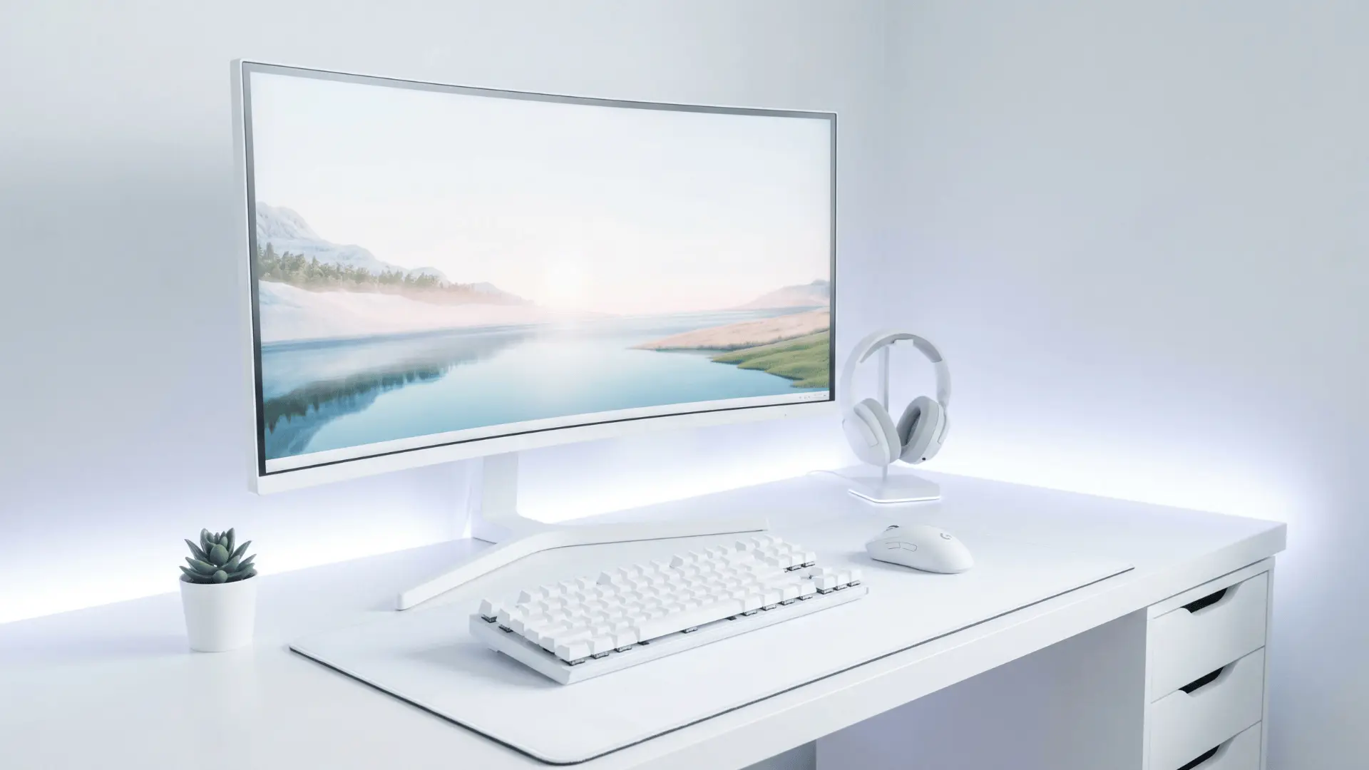 All-white desk setup with monitor and minimal accessories in a clean layout