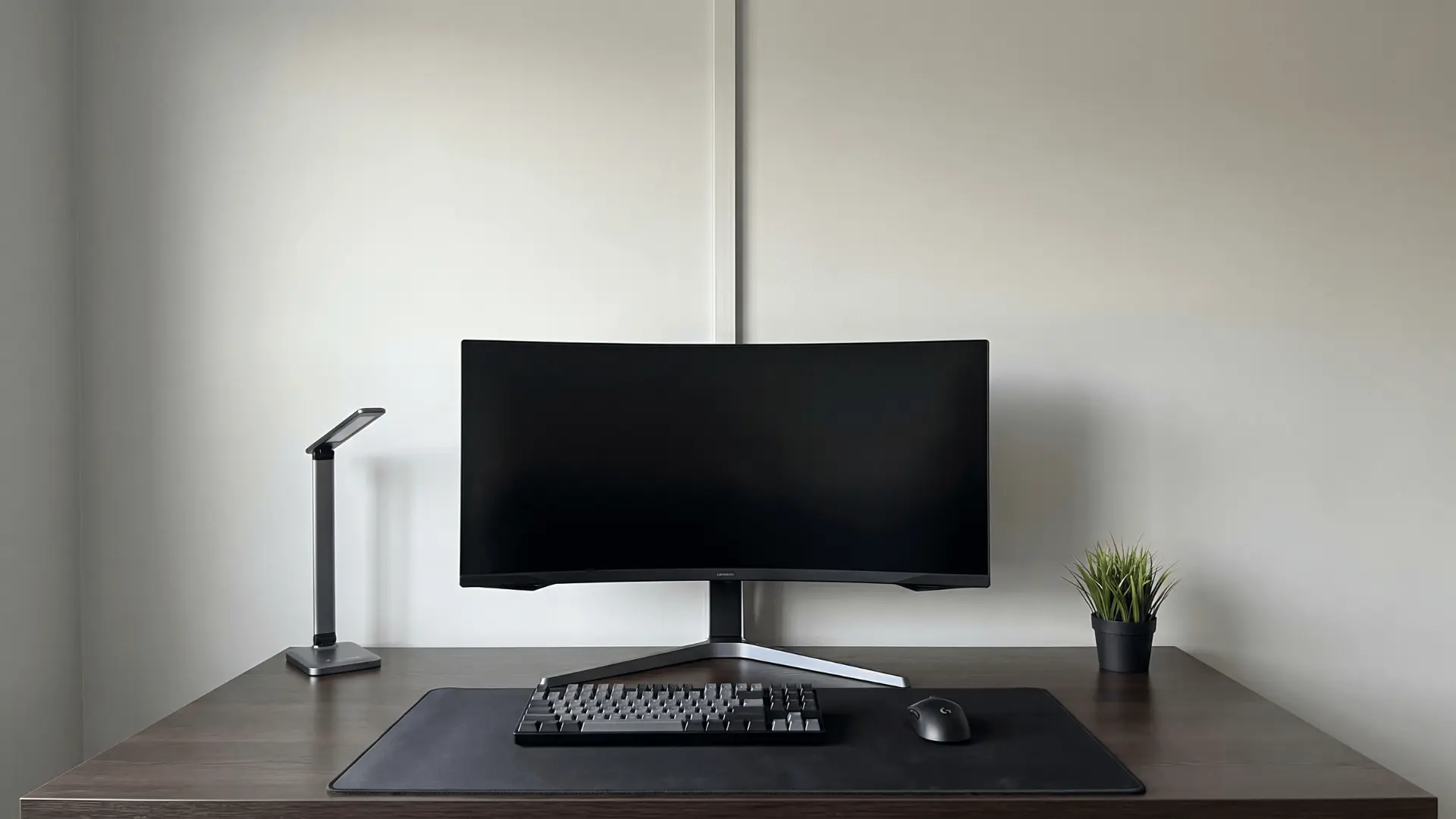 Desk setup with no visible cables due to hidden wall cable routing
