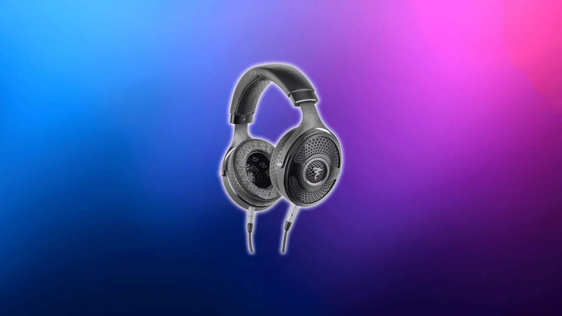 Focal Utopia open-back audiophile headphones with wired cable on a blue and pink gradient background