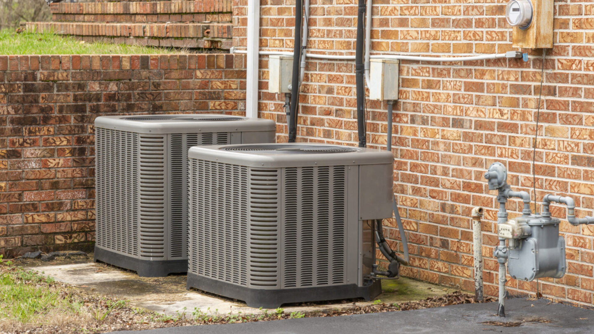 central air conditioner unit outside a home for energy efficient whole house cooling setup