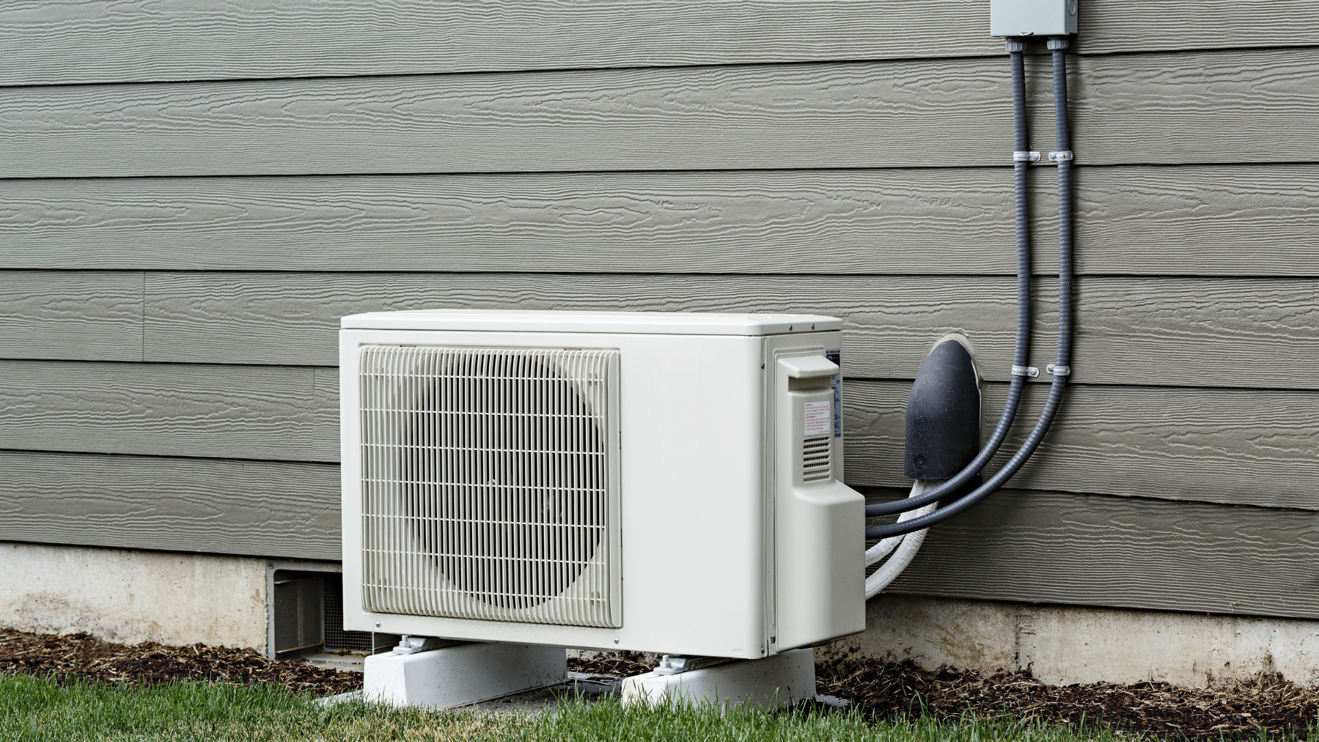 ductless mini split system mounted on a wall for energy efficient room heating and cooling