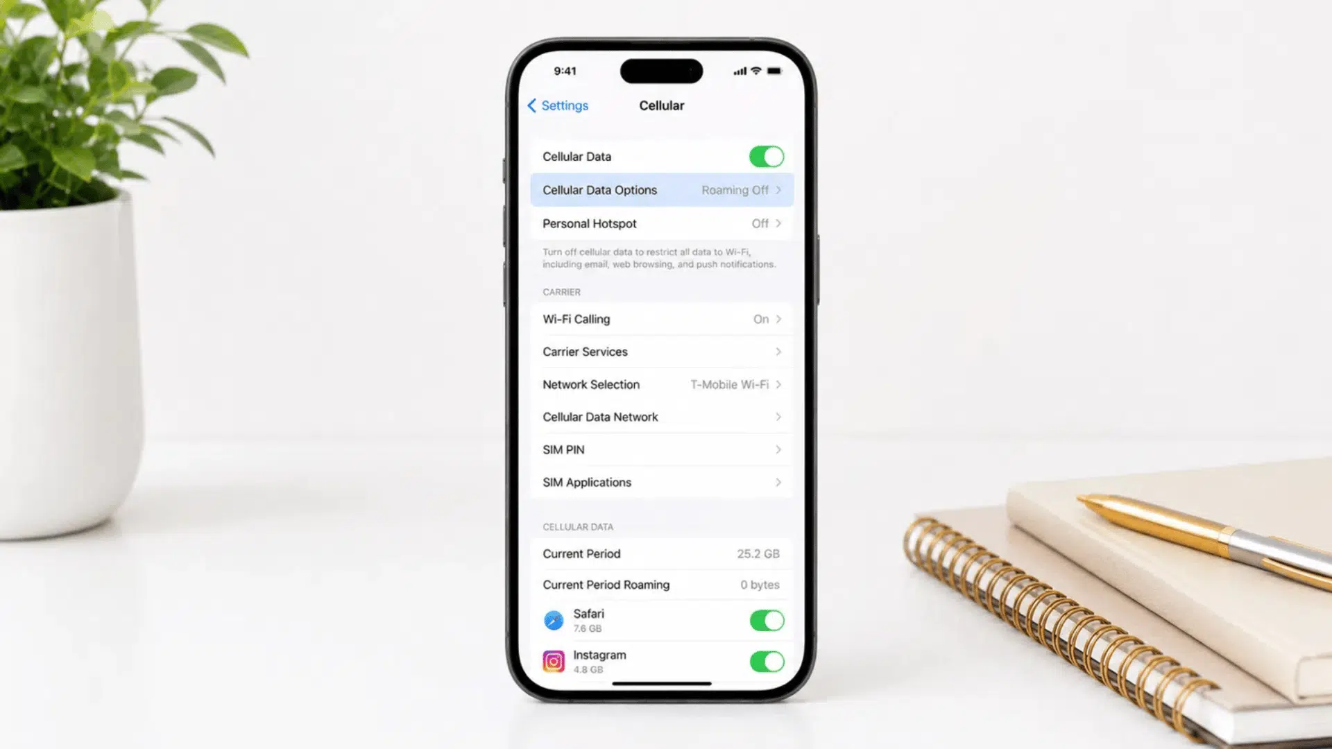 iphone cellular menu with cellular data options highlighted in blue on white desk