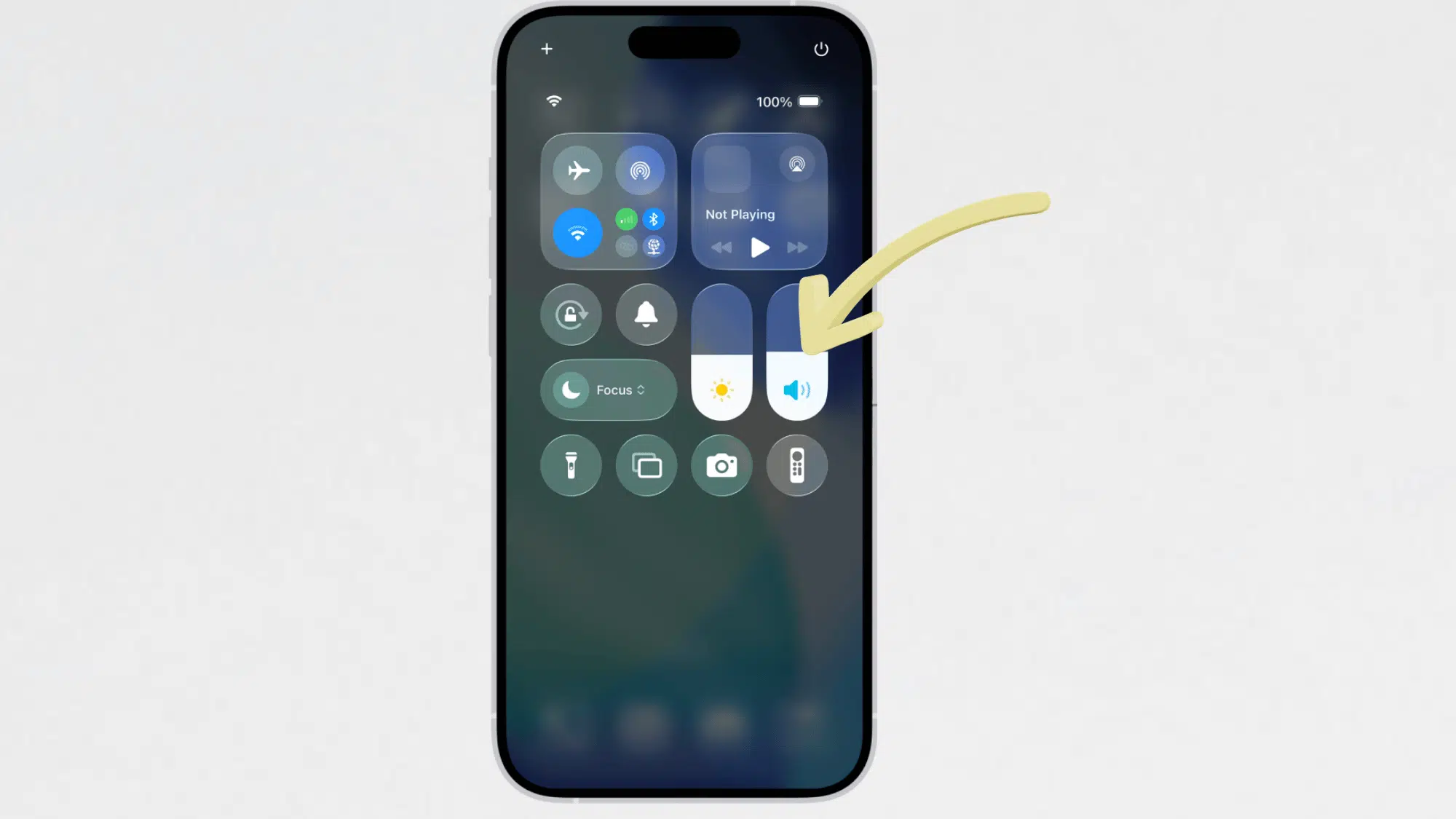 iphone control center showing the volume slider highlighted with a yellow arrow pointing to the sound controls
