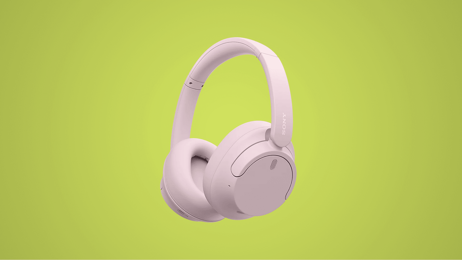 soft pink Sony WH-CH720N wireless headphones with cushioned ear cups displayed on a light green background.