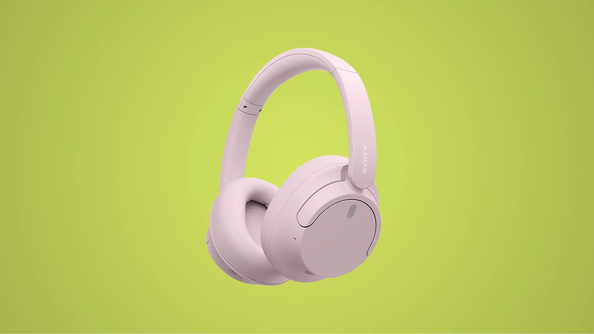 soft pink Sony WH-CH720N wireless headphones with cushioned ear cups displayed on a light green background.