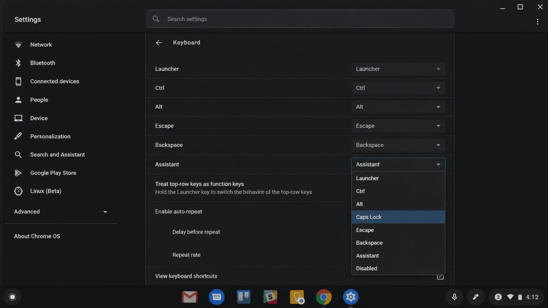 the chrome os keyboard settings in dark mode showing system configurations and keyboard settings