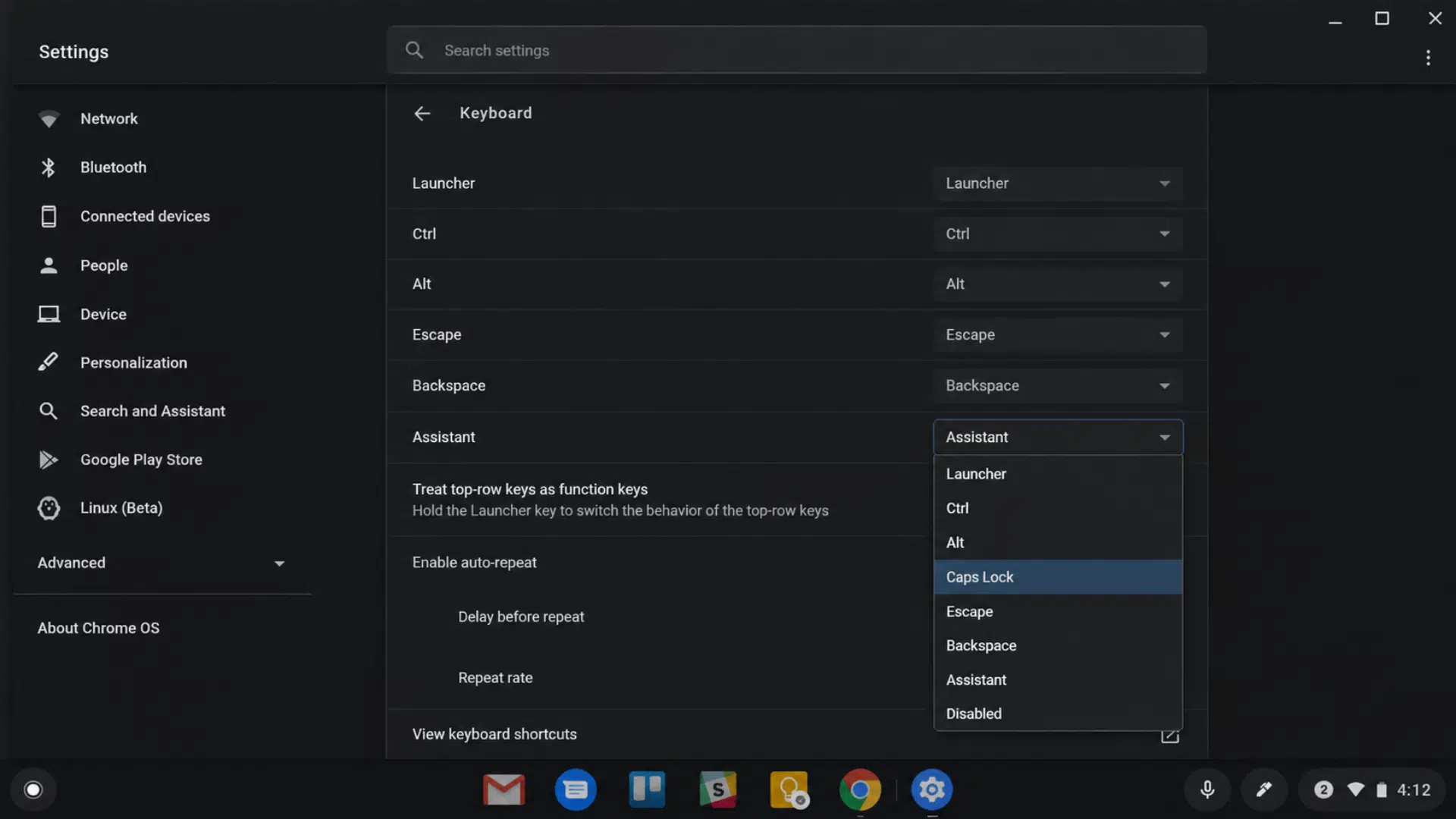 the chrome os keyboard settings in dark mode showing system configurations and keyboard settings