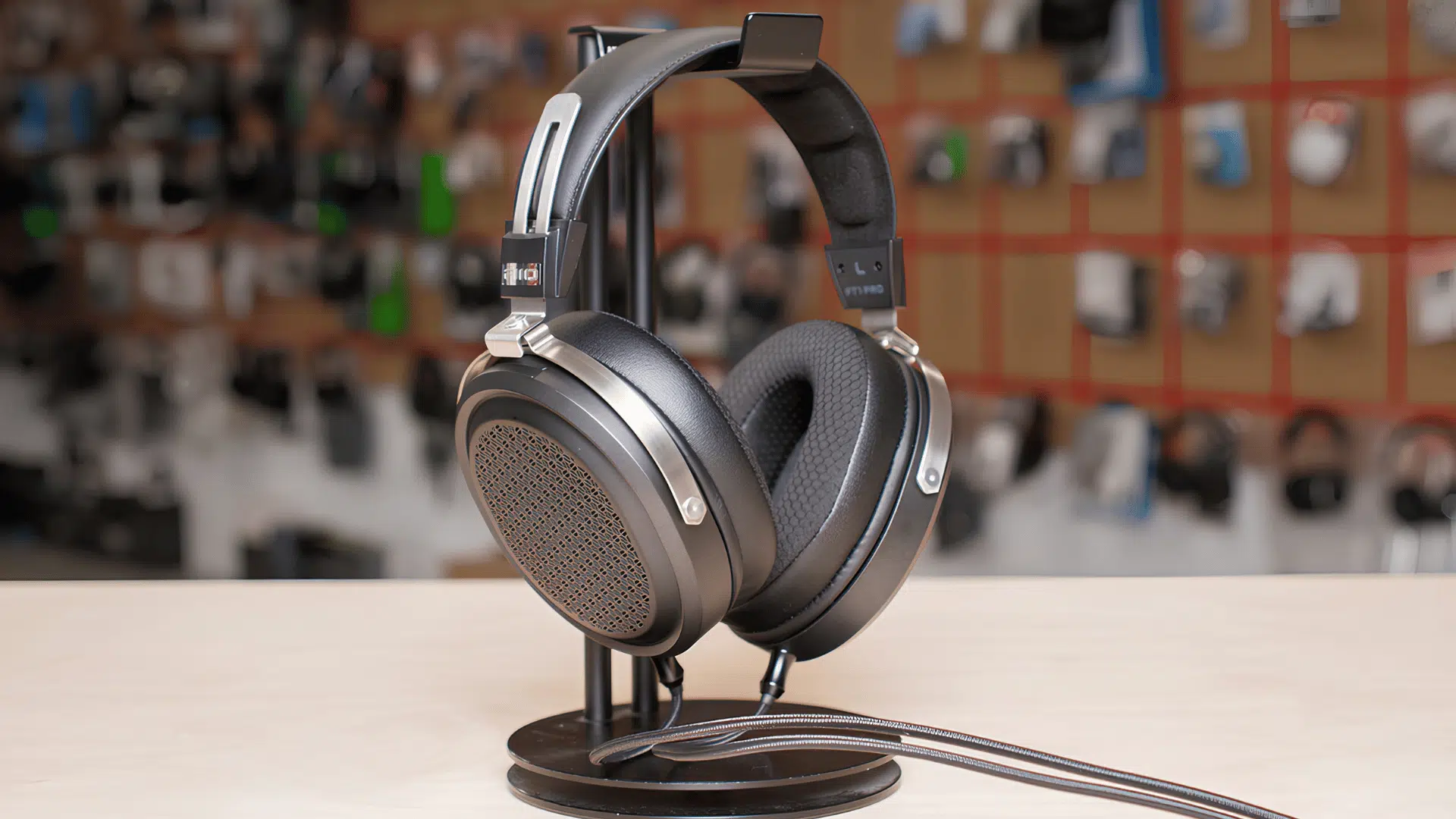 fiio ft1 pro headphones placed on a stand showing over ear design and detailed ear cups in a studio setup
