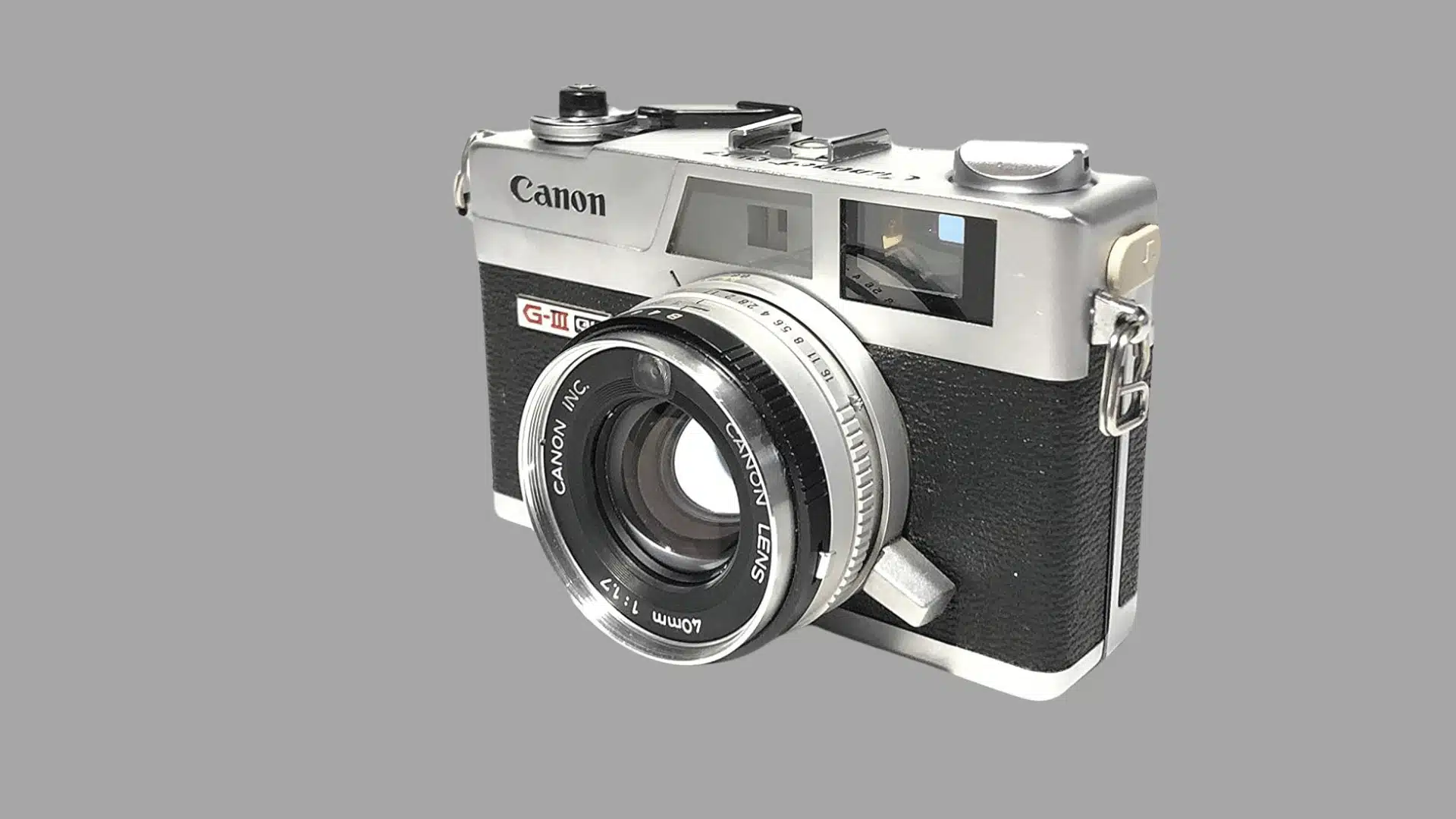 Three-quarter view of a silver and black Canon Canonet QL17 G-III film camera with a 40mm lens.