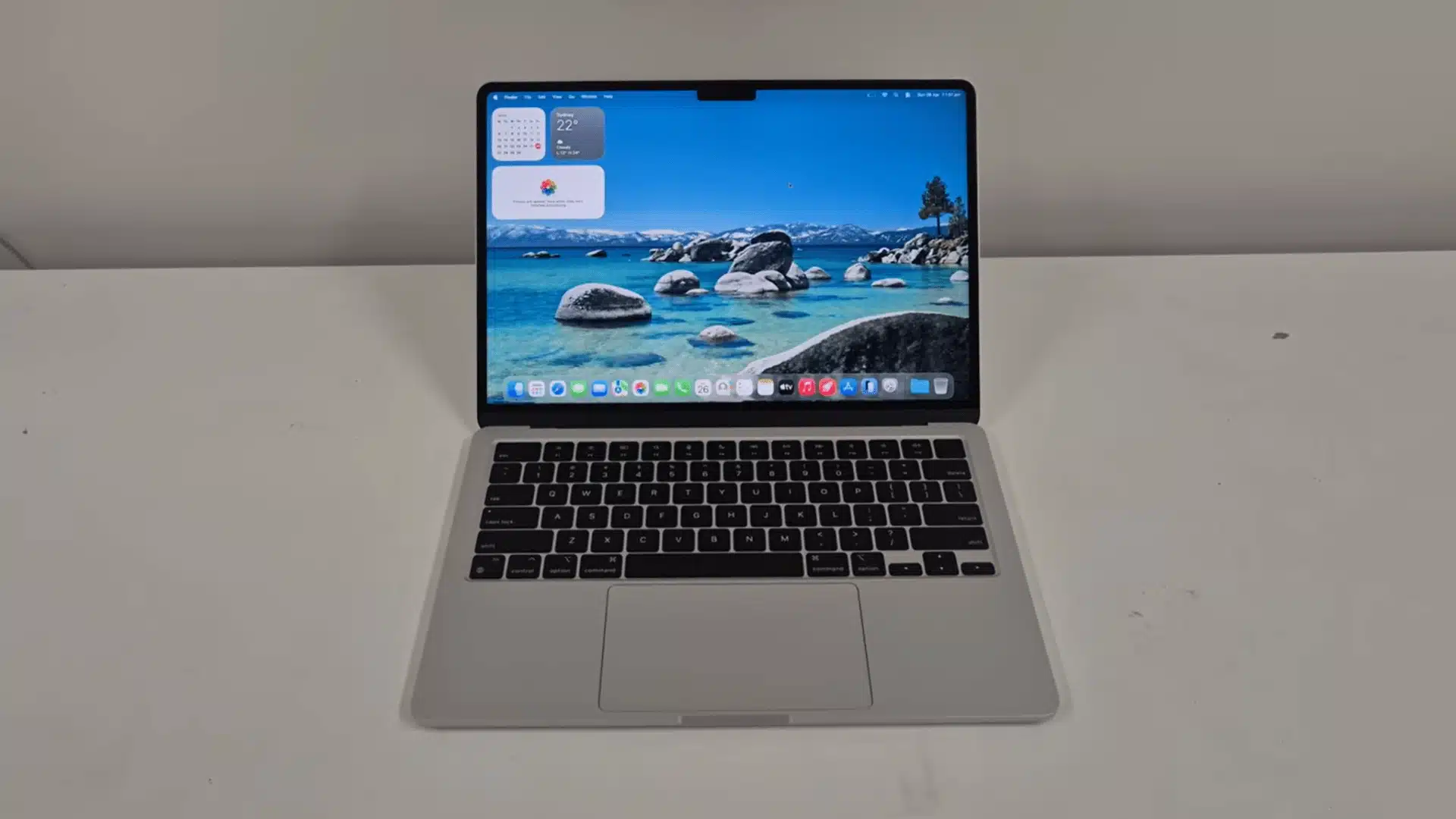 MacBook Air showing the macOS desktop before starting the factory reset process.