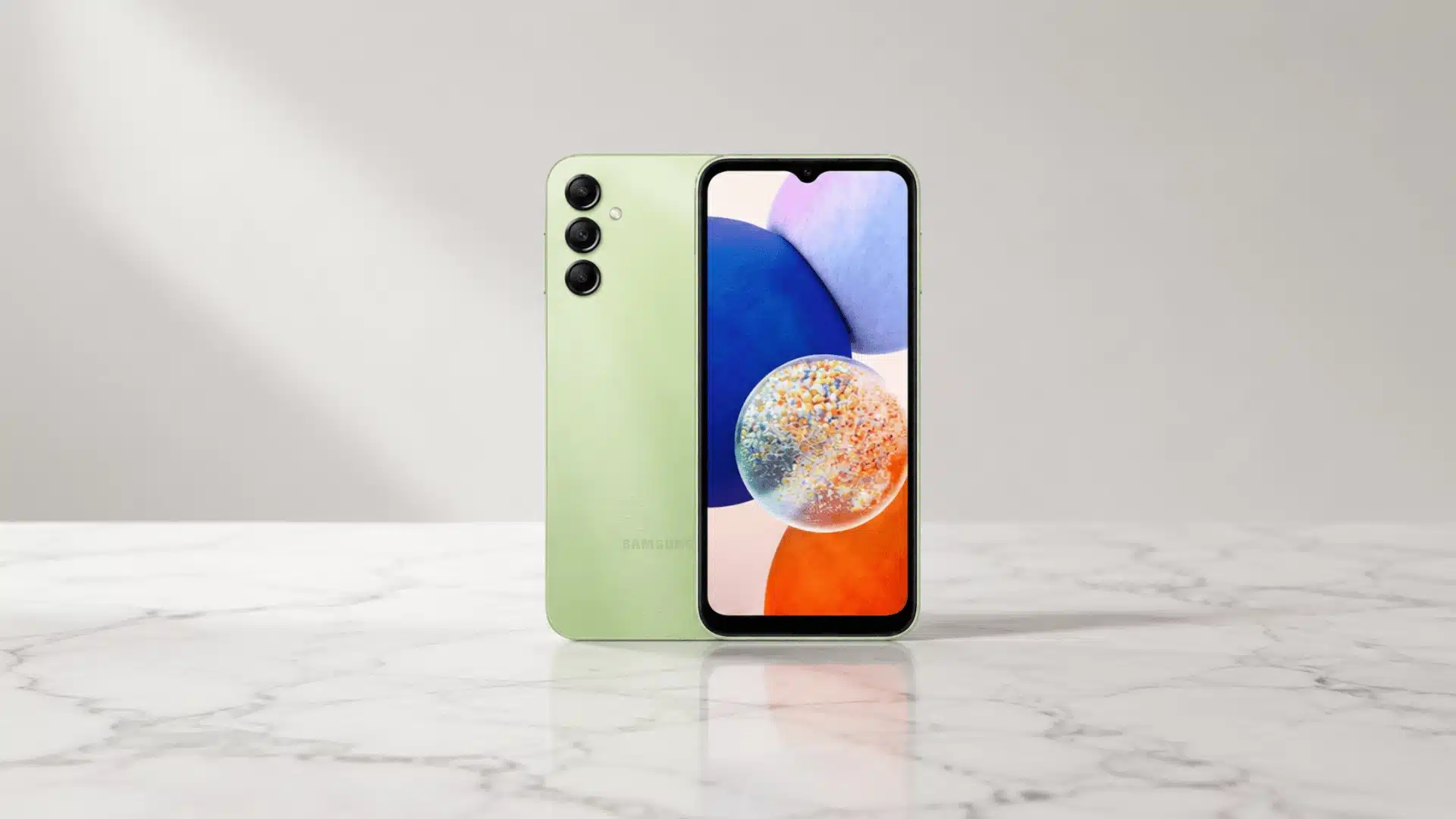 Light green Samsung smartphone displayed front and back on a white marble surface