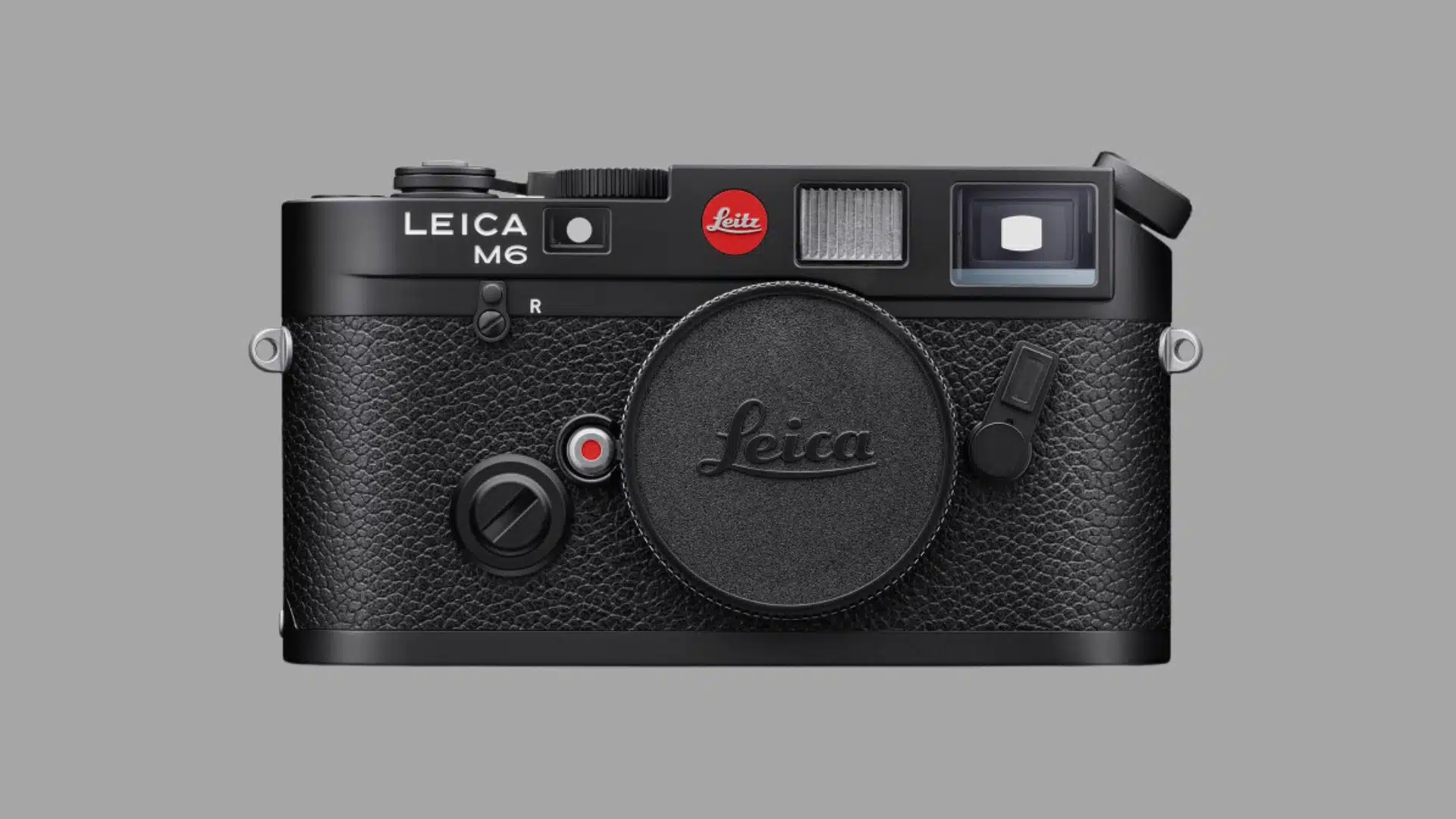 Front view of a black Leica M6 rangefinder film camera body with a lens cap on a white background.