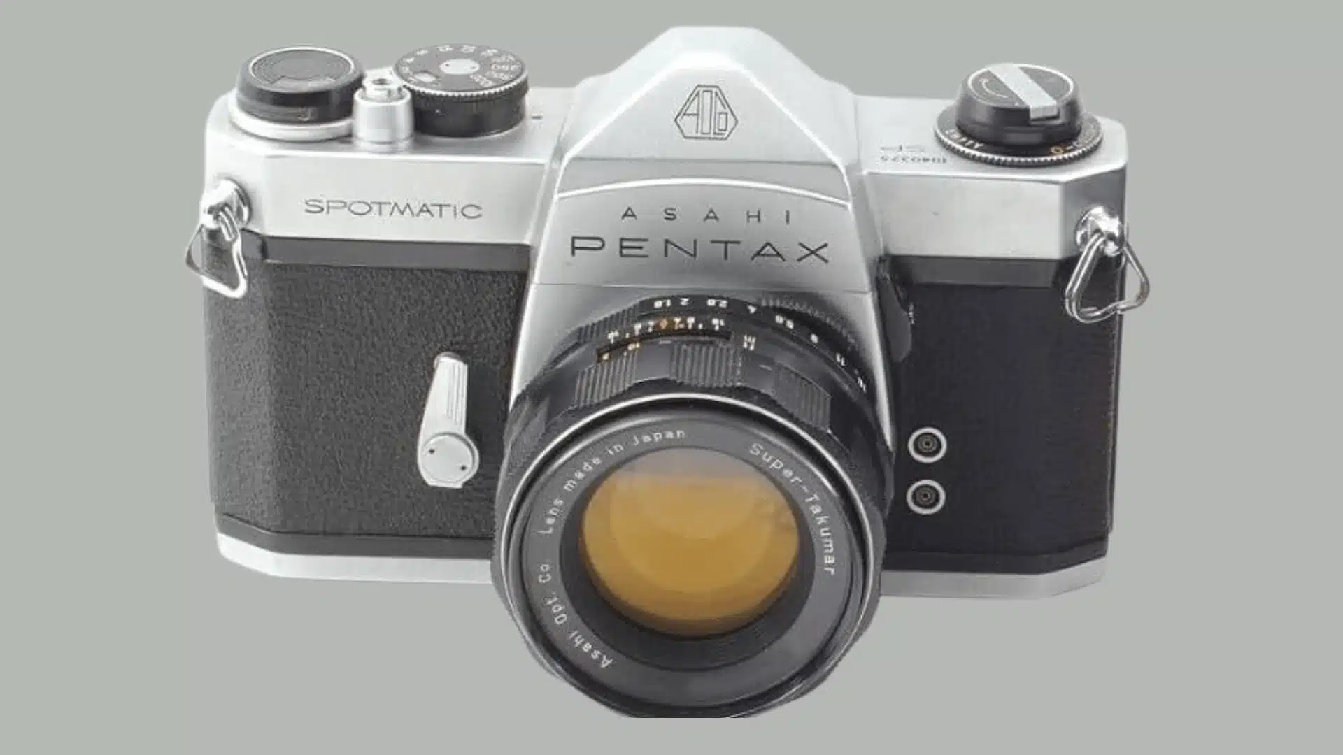 Front view of a silver and black Asahi Pentax Spotmatic film camera with a Super-Takumar lens.