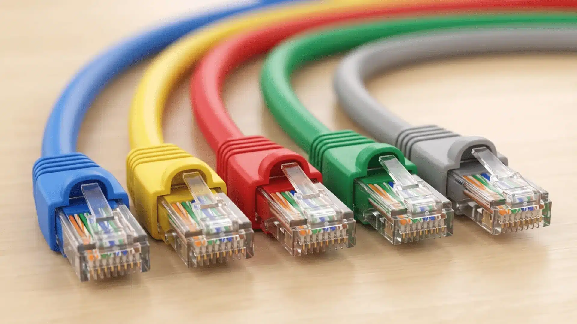 Blue, yellow, red, green, and gray Ethernet cables with matching RJ45 wiring Filename: colored-jackets-ethernet-cable-ends