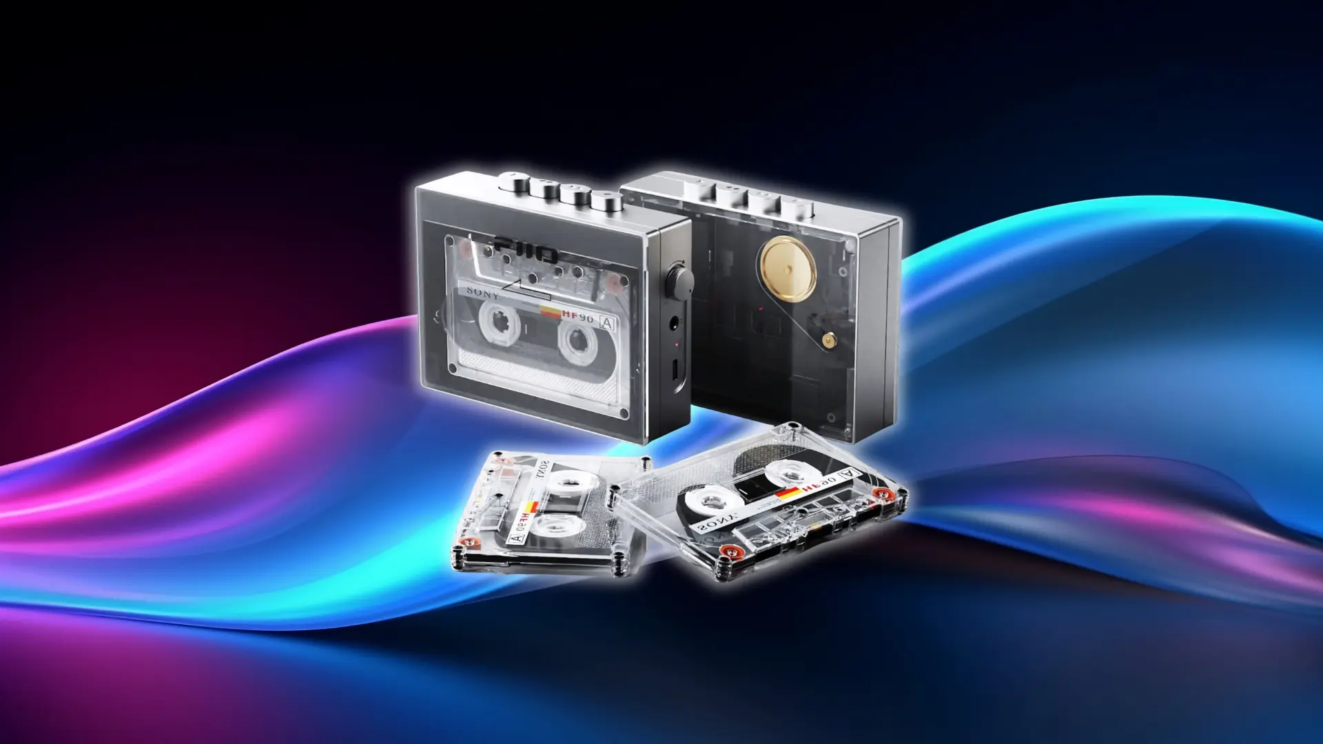 Two modern FiiO CP13 cassette players, one with a tape loaded and one empty, displayed from the front and side angles.
