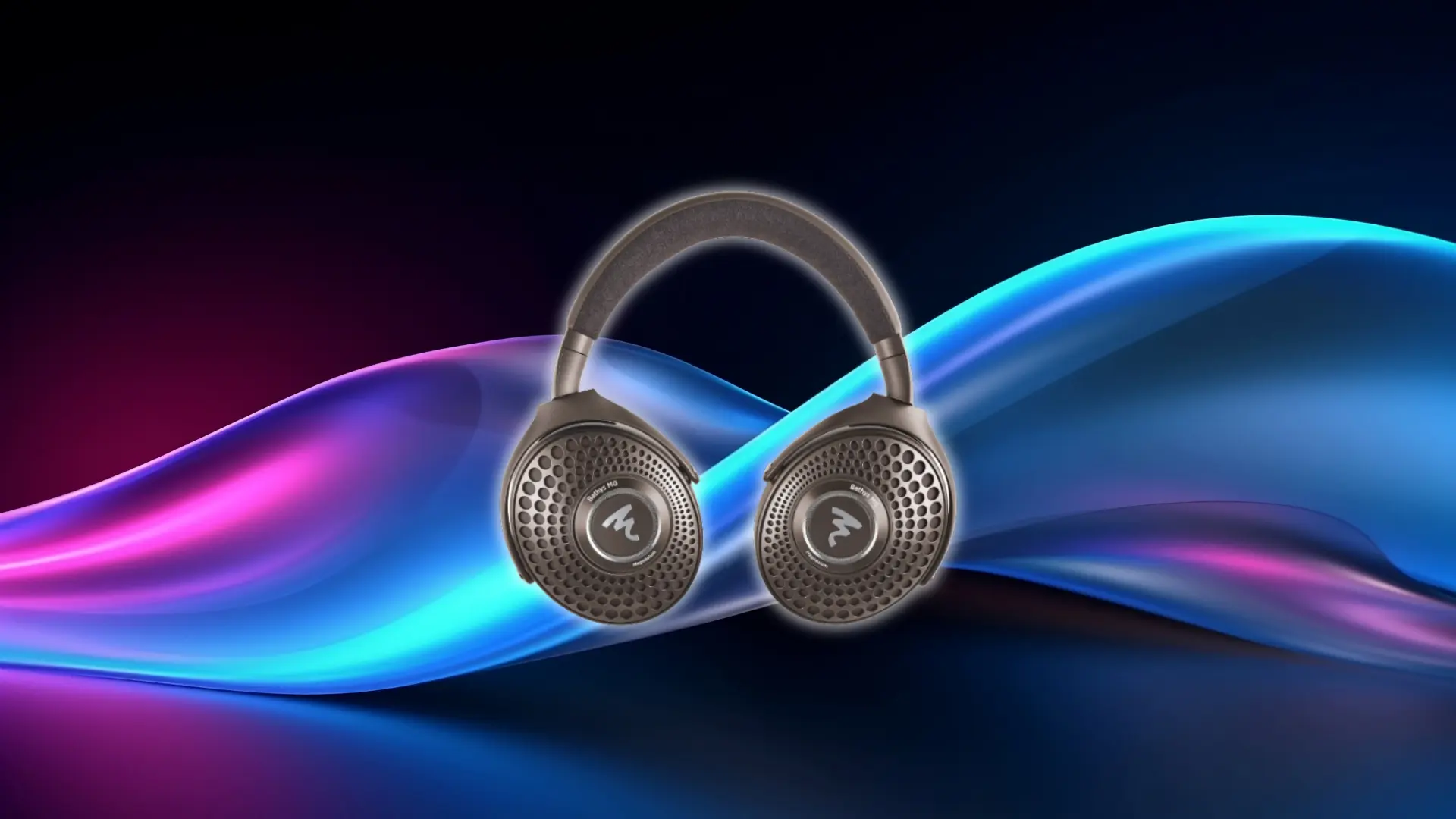 Focal Bathys MG wireless headphones centered against a dark background with colorful flowing wave light effects in blue, purple, and pink tones.