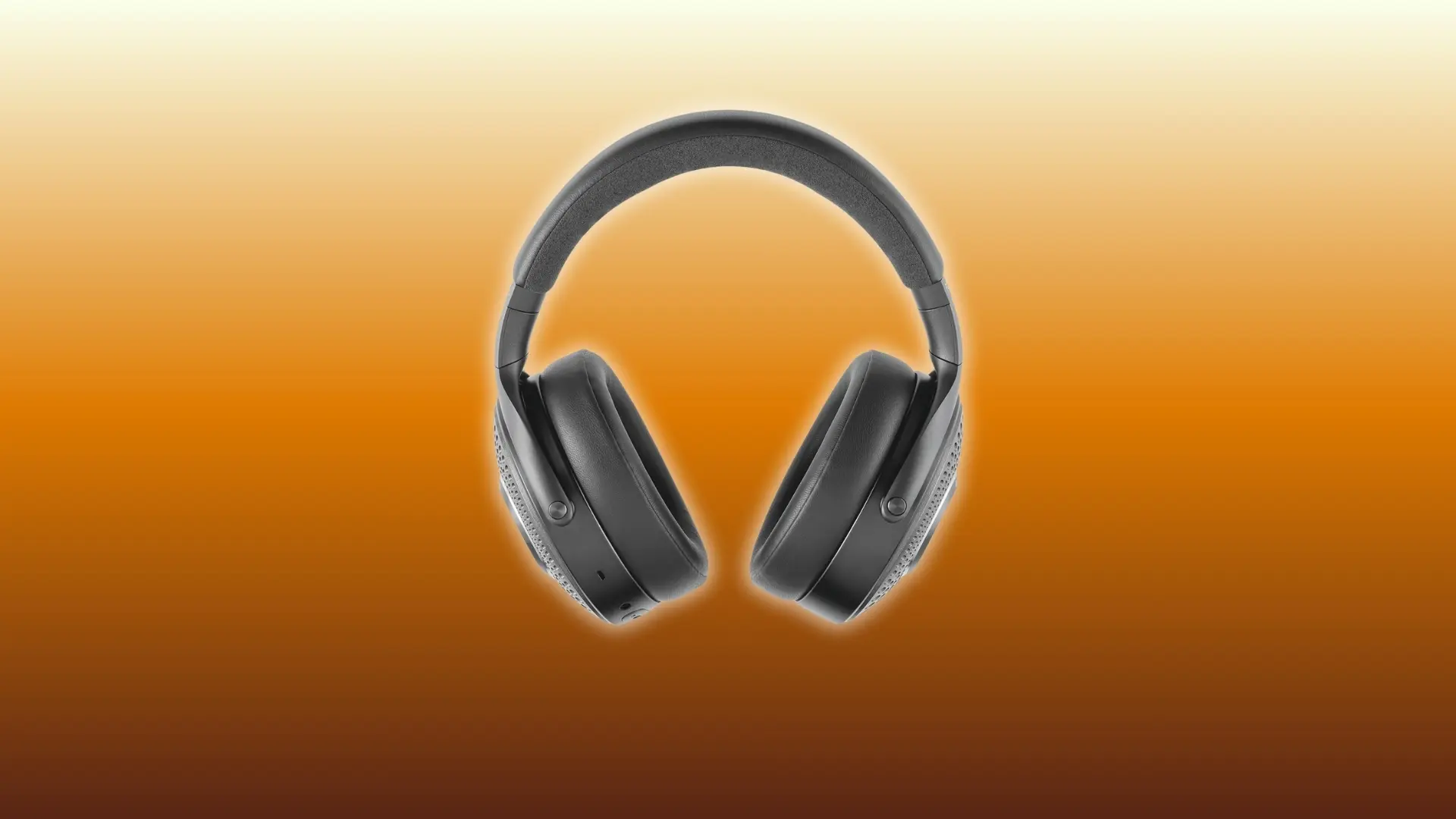 Black over-ear headphones displayed against an orange gradient background.
