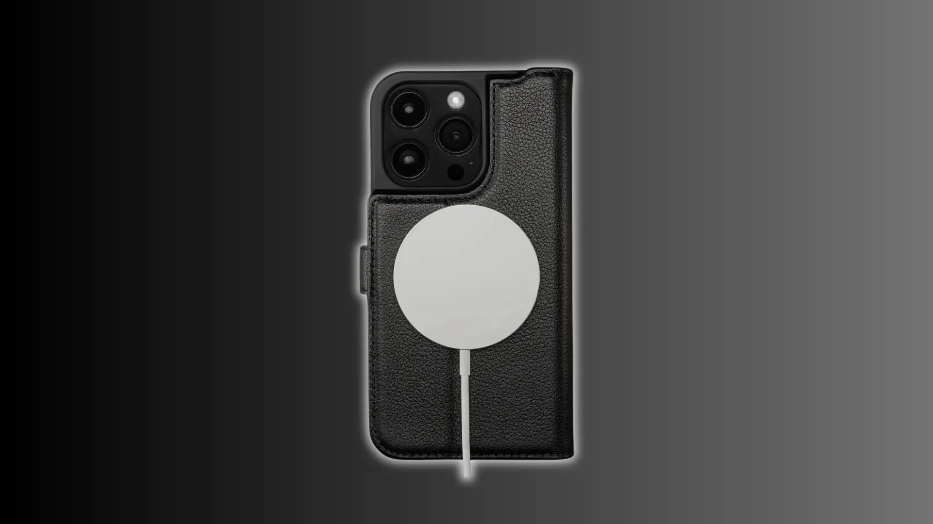 Black leather iPhone 15 Pro case with MagSafe charger attached