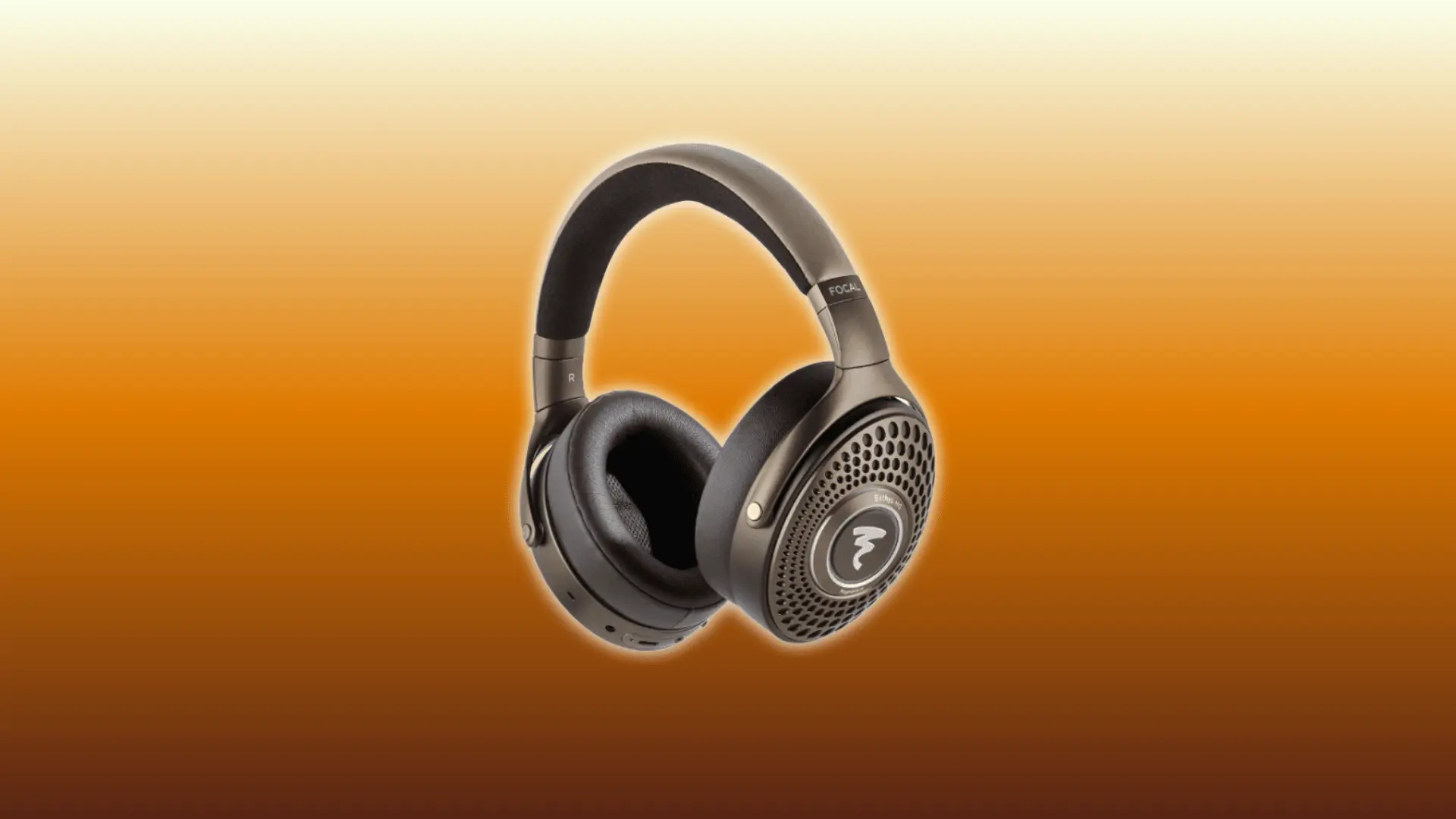 Focal Bathys MG wireless over-ear headphones floating against an orange gradient background with soft glow lighting around the headphones.
